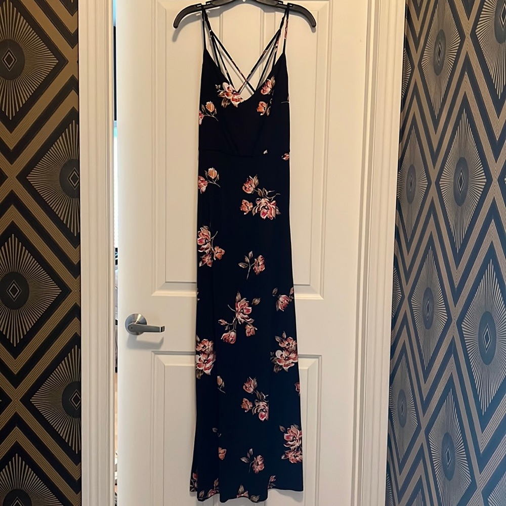 Black sleeveless maxi dress with flower detail